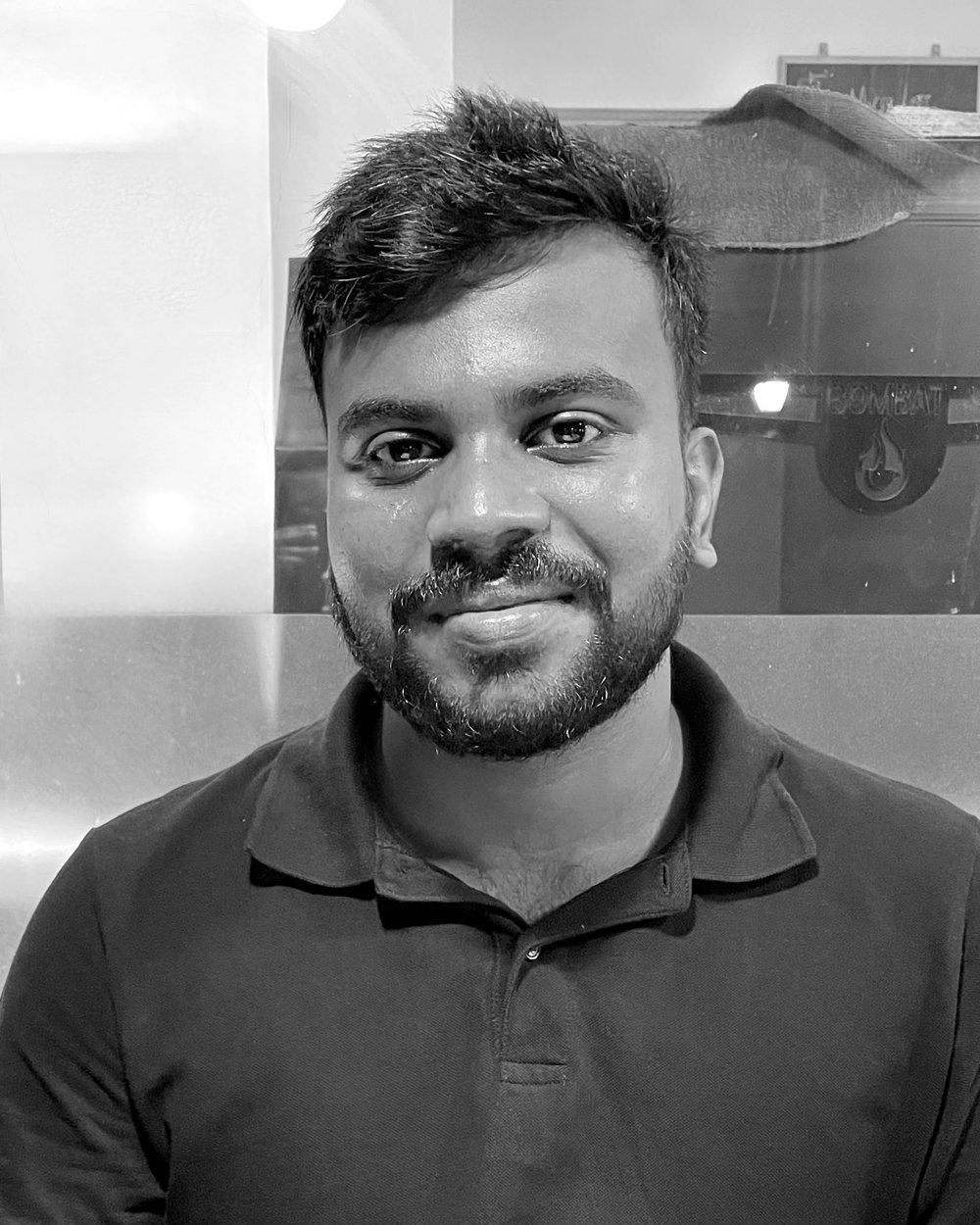Black and white portrait of Vinayak Ajith